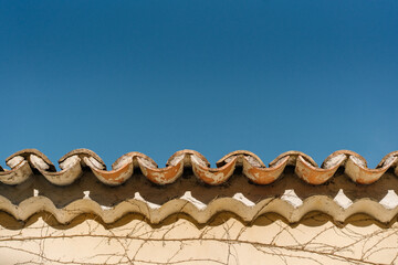roof tiles on the roof and blue sky, copy space