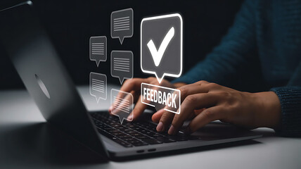 Person typing on a laptop with digital checkmarks and speech bubbles symbolizing feedback and approval in a modern workspace