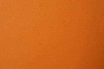 Abstract art, orange paper background. Abstract design of monochrome paper background