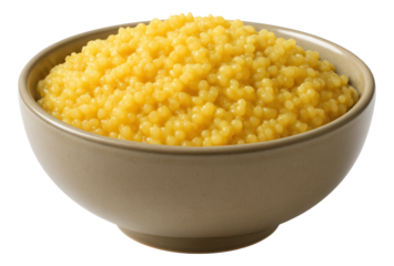 Spinach leaves with goat cheese crumbles in a shallow terracotta bowl