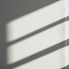 Shadows cast by blinds on a light-colored wall.