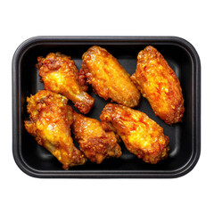 Crispy fried chicken wings in a black plastic tray (1)