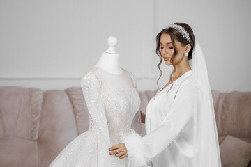 Bridal fitting session with elegant white wedding dress in a soft and inviting atmosphere
