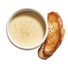 Creamy soup in small bowl with toasted bread slices