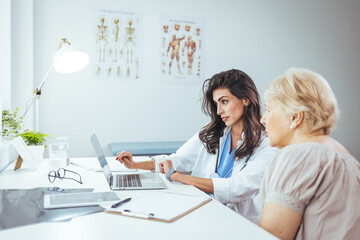 Healthcare Professional Consulting Elderly Patient in Modern Medical Facility