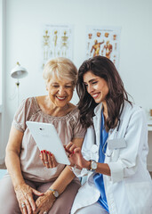 Doctor Discussing Treatment Options With a Patient Using a Tablet in a Clinic