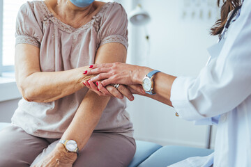 Doctor Holding Patient's Hands in a Supportive and Compassionate Manner