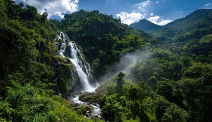 Fototapeta premium Lush waterfall cascading down mountainside