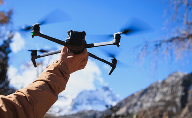Flying drone in high altitude mountains
