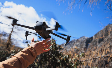 Flying drone in high altitude mountains
