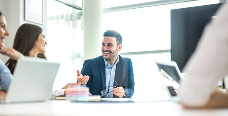 Business man discussing and explaining during important company meeting at conference table