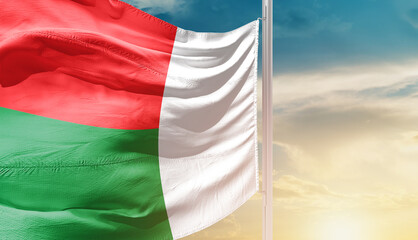 Madagascar national flag waving in an amazing sunlight. National flag waving on mast.