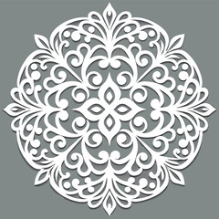 Intricate white floral mandala design on a gray background, symmetrical and ornate.
