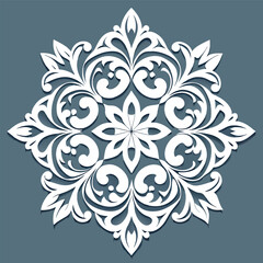 Intricate white snowflake design on a blue background.
