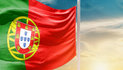 Portugal national flag waving in an amazing sunlight. National flag waving on mast.