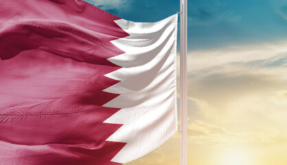 Qatar national flag waving in an amazing sunlight. National flag waving on mast.