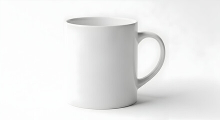 Fototapeta premium White ceramic coffee mug with handle on seamless white background, isolated studio product shot