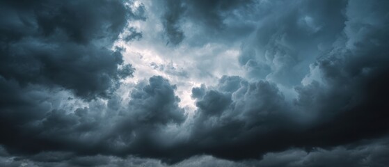 Obraz premium The Clouds Dominating the Sky in a Dramatic Storm with Moody Blue Light