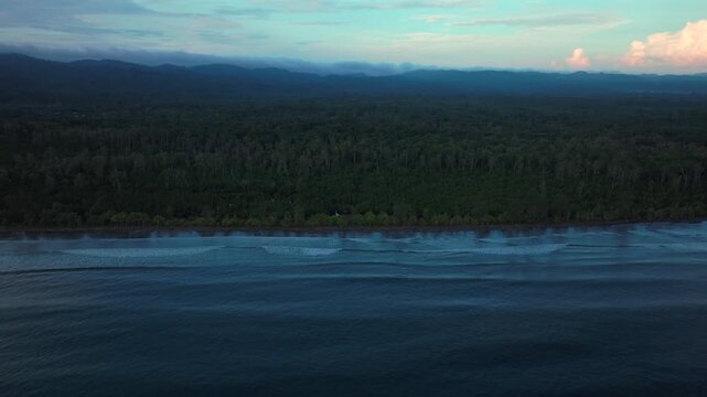 Wewak Cape Wom Meri beach Dogreto Bay Madang Harbor View Papua New Guinea aerial drone Kavieng Vanimo Tufi coastline rain clouds fog sunny skies untouched morning remote tropical shore waves downward