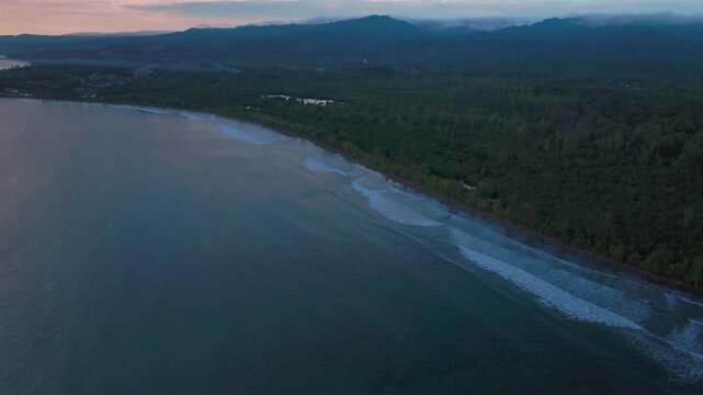 Wewak Cape Wom Meri beach Dogreto Bay Madang Harbor View Papua New Guinea aerial drone Kavieng Vanimo Tufi coastline rain clouds fog untouched morning remote tropical shore waves forward pan up