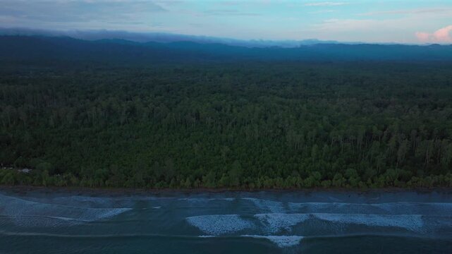 Wewak Cape Wom Meri beach Dogreto Bay Madang Harbor View Papua New Guinea aerial drone Kavieng Vanimo Tufi coastline rain clouds fog untouched morning remote tropical shore waves backwards motion