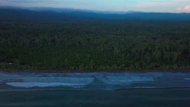 Wewak Cape Wom beach Dogreto Bay Madang Harbor View Papua New Guinea aerial drone Kavieng Vanimo Tufi coastline rain clouds fog untouched morning remote tropical shore waves forward pan up