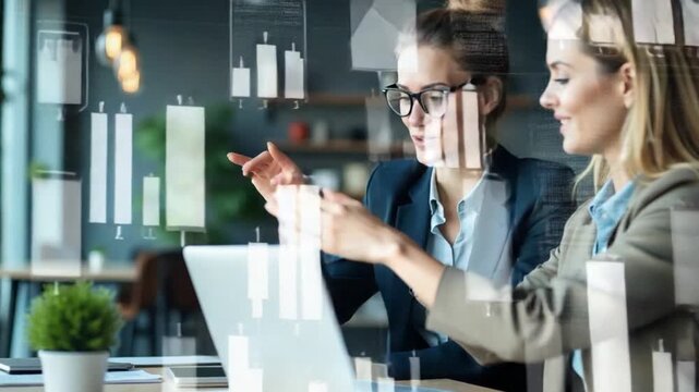 Vertical Powerful businesswomen using a laptop with isolated display, exchanging reports and strategy insights with data visualization. Work environment and productivity in company workspace. Camera A