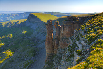 A panoramic aerial view of the Two Monks rock on the Bolshoy Bermamyt plateau, North Caucasus, without people, at daytime, Stavropol Krai, Russia