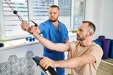 Patient engages in physical therapy with doctor at rehabilitation center for recovery