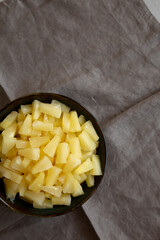 Canned Pineapple Tidbit Chunks in a Bowl, top view. Copy space.