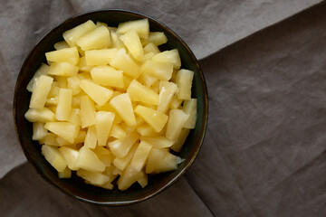 Canned Pineapple Tidbit Chunks in a Bowl, top view. Copy space.
