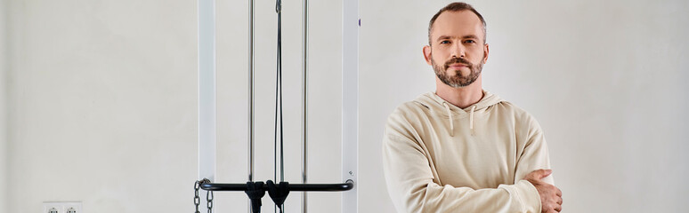 Man undergoes rehab at a modern clinic, focusing on recovery and wellness
