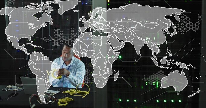 Technician in checkered shirt handling yellow Ethernet cables in tech lab, with laptop, copy space - Powered by Adobe