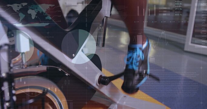 Fototapeta Pedaling gym-goer engaging bike pedal against flywheel in fitness center, with overlay charts