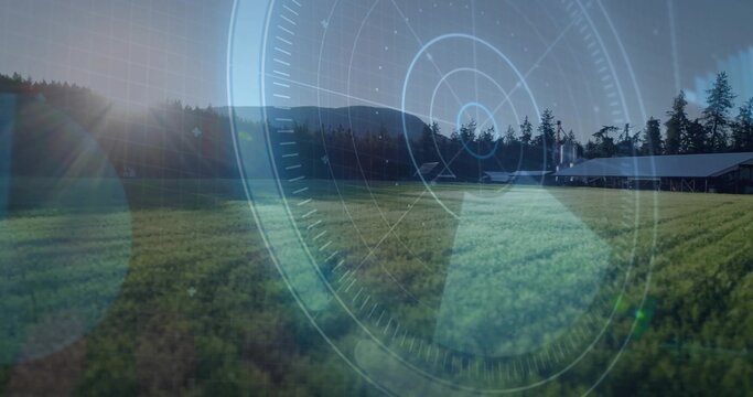 Fototapeta Displaying cultivated green field in rural farmland, with pine tree line, barn, lens flare and HUD