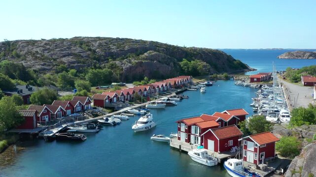 Colourful wooden sheds at Swedish village by the sea. Bohus Malm&ouml;n close to Sm&ouml;gen
