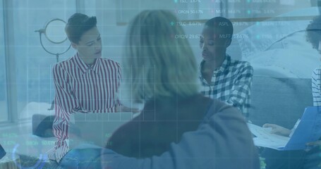 Collaborating four professionals analyzing data overlay in meeting nook, with laptop ring light