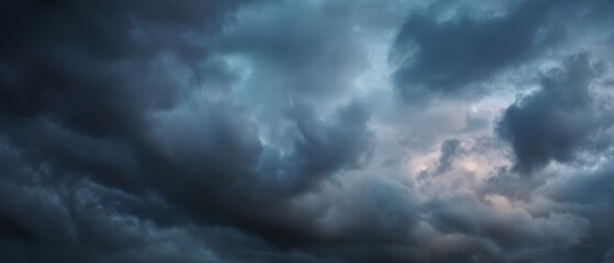 Obraz premium The Storm Clouds Gathering Over a Moody Dramatic Evening Sky Full of Texture