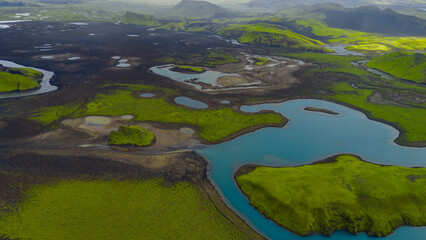 Aerial View of Iceland's Moss Covered Terrain and Volcanic Soil