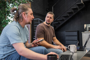 Group of professional it programmers collaborating in a modern office setting. They display focus and enthusiasm, creating a dynamic work environment. 