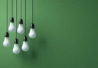 Green wall with hanging light bulbs.
