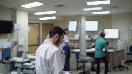 Obraz premium A blurry image of a hospital room. Nurses and doctors at a hospital. Doctors are busy with technology and equipment. An indistinct picture of a hospital room lifestyle.