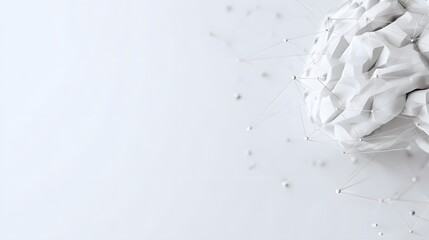 white paper brain model on a white background.