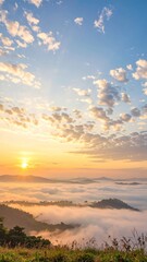 Obraz premium Sunrise paints the sky with golden hues over misty mountains, creating a serene and breathtaking landscape at dawn, evoking peace and tranquility.