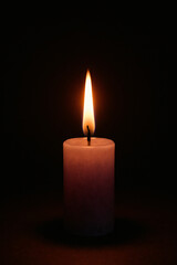 Single Candle Flame in Dark Purple Light