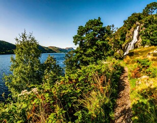 Scenic lakeside trail with waterfall