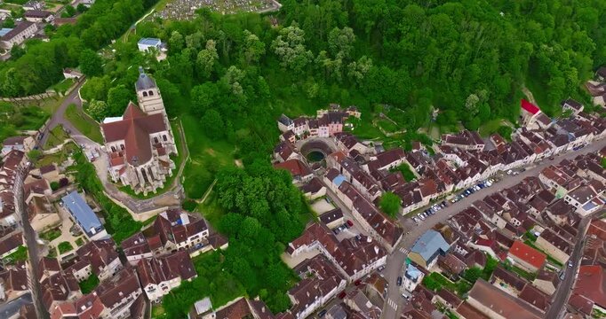 Aerial view of ancient town of Tonnerre with unusual water reservoir Fosse Dionne. Burgundy France