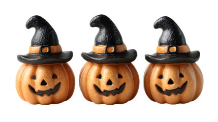 Trio of carved pumpkin lanterns with witch hats, isolated on white background