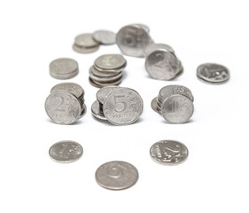 Pile of silver coins with the number 5 on them