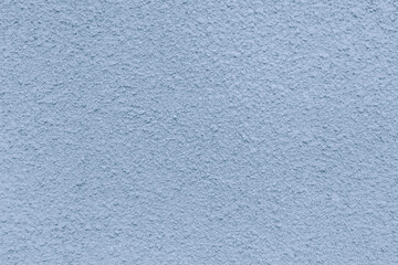 Fototapeta premium The blue concrete wall has a rough texture.